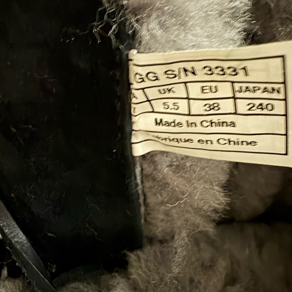 UGG Black and Cream Lace Up Boots with Timeless Style